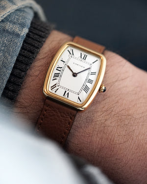 1970s Cartier Incurvée | Faberge Mark 1 Dial - Early Production | Paris Dial | Mécanique | 18kr Yellow Gold | With Box and Two New Straps